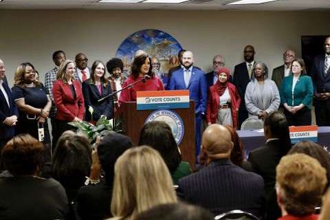 Michigan Gov. Gretchen Whitmer surrounded by lawmakers