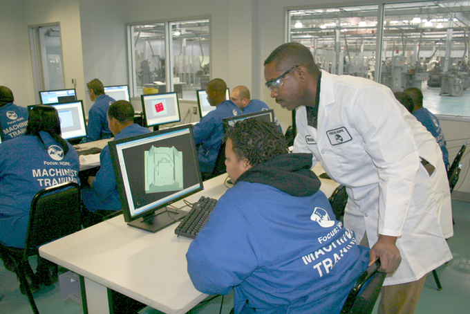 ON TRACK: Students learn machinist skills in a Focus: HOPE classroom. The program is designed to put them on a career path to a middle-class income. (Courtesy photo)