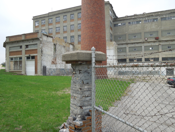 An abandoned flour mill is Hillsdale’s version of the Detroit’s Michigan Central Station, an eyesore looming near downtown. The mill closed about a decade ago. (Bridge photo by Ron French)