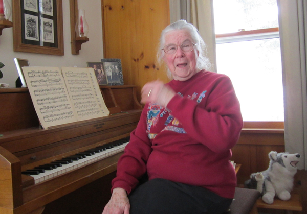 Sitting at her piano, Phyllis Senske, 81, can see, feel and smell the Encana fracking operation outside the window of her childhood home in Rapid River Township. 