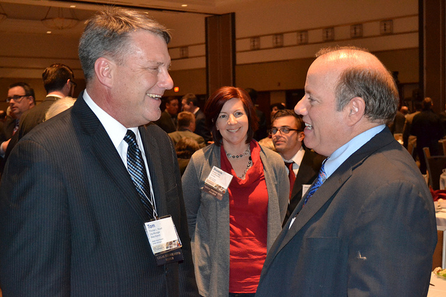 Detroit Mayor Mike Duggan talks with West Branch City Manager Tom Youatt at the Michigan Municipal League's 2014 Capital Conference. Duggan has been strategic in setting targets he knows he can meet. (Photo by Flickr user Michigan Muncipal League; used under Creative Commons license)
