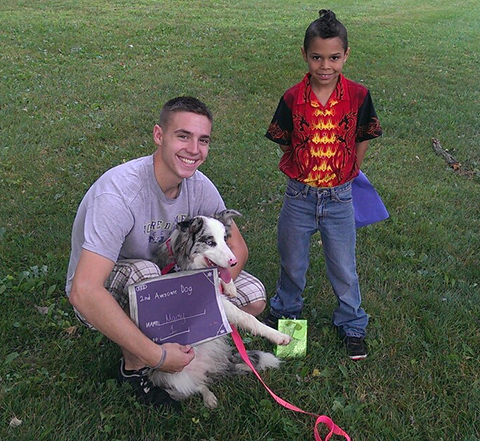 Isaac Torok, 8, staged his first"Dog Olympics" in Lansing last year, and is doing it again July 26. (Courtesy photo)