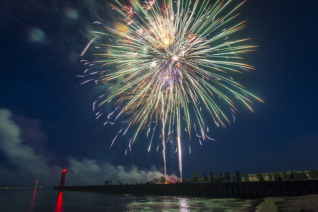 The rockets’ red glare, mirrored in a lake. No presents necessary, all cooking done outside. What’s not to love? (Photo by Flickr user olsonj; used under Creative Commons license)