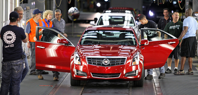 The first 2013 Cadillac ATS available for retail sale is prepared to roll off the assembly line in 2012, at the General Motors Lansing Grand River Assembly Plant in Lansing. GM is injecting a boost into the Lansing area’s manufacturing sector by investing in plant production, including plans for a stamping facility at the same plant. (Photo by Flickr user That Hartford Guy; used under Creative Commons license)