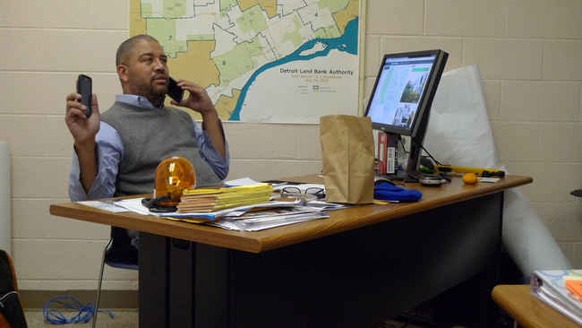 When Detroit district manager Marshall Bullock gets to returning phone calls from residents, he frequently finds himself using two – his city-provided phone and his personal one. (Bridge photo by Nancy Derringer)