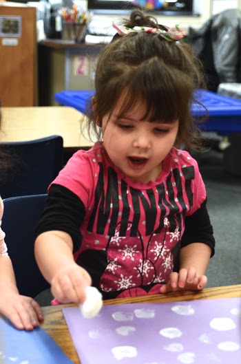 Elizabeth Lamb is learning her ABC’s and how to spell her name, while Michigan learns the value of expanded state-funded preschool. (Photo by Sam Zomer)