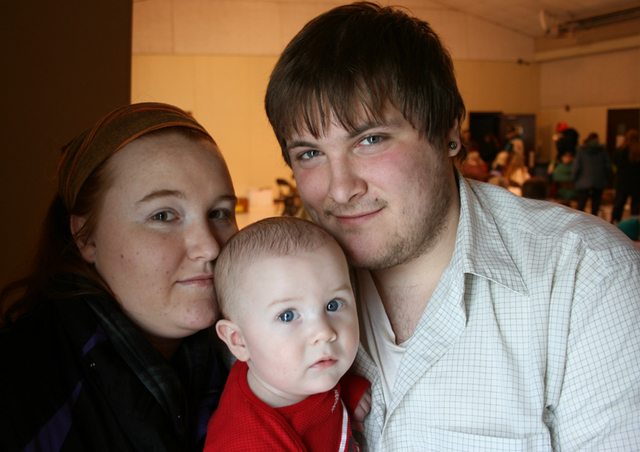 Charles Jewell, 20, his fiancee, Morgan Griffin, 20, and their infant son, Kamden are struggling to get by in Cheboygan. (Bridge photo by Ted Roelofs)