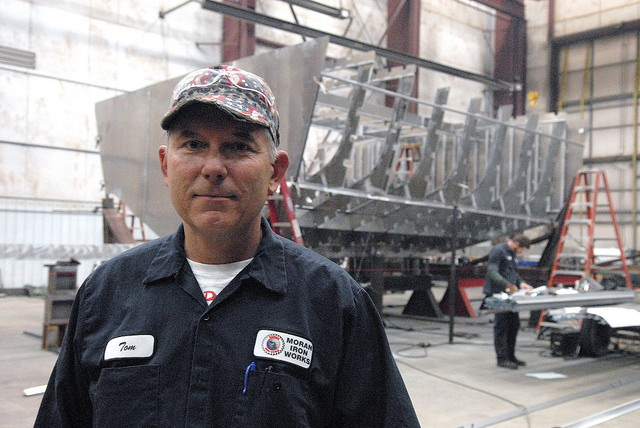 Tom Moran stands in his shop, Moran Iron Works of Onaway, while the skeleton of a new Shepler's Mackinac Island ferry, a $4 million contract, rises behind him. (Bridge photo by John Russell)