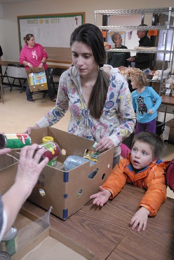 Lindy VanSickle, 23, and her 4-year-old son, DeWayne, rely on food they get from an Emmet County food pantry. (Bridge photo by John Russell)