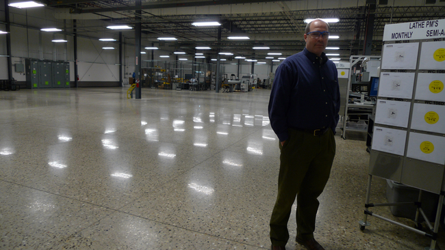 Todd Fewins would like to expand Precision Edge’s surgical-instrument business into this empty floor space, but is having trouble finding qualified workers. (Bridge photo by Nancy Derringer)