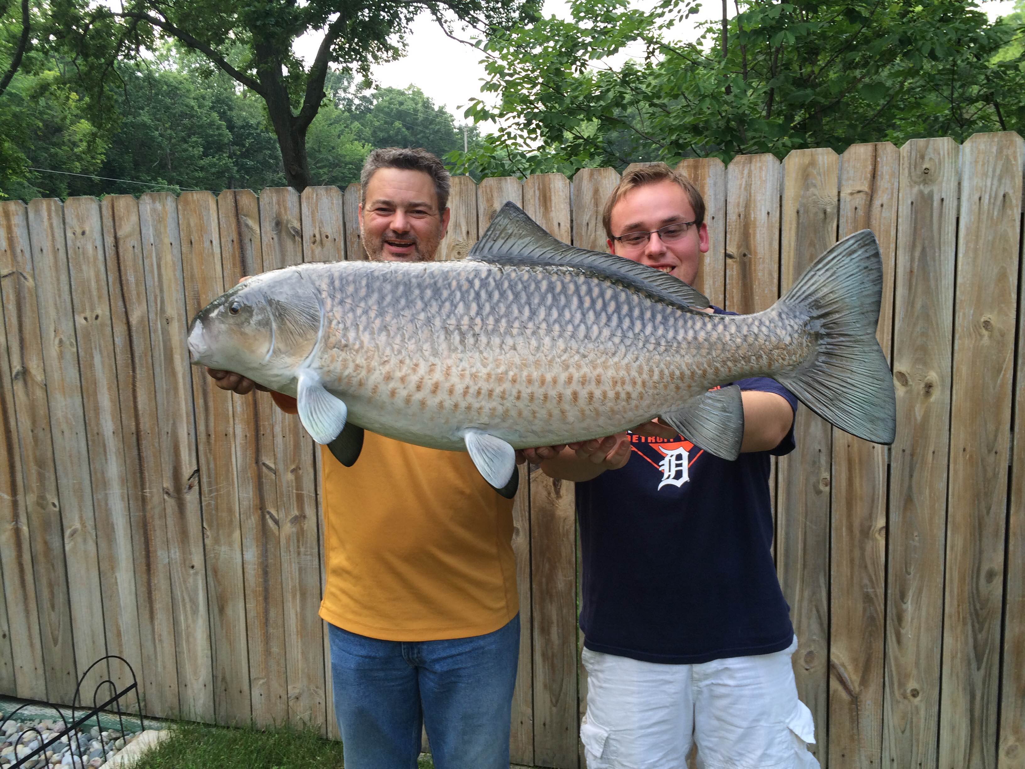 Tony and Josh Witherell hold a monster buffalo fish they caught in west Michigan. They’ve earned numerous master angler patches for fish they’ve caught over the years. (courtesy photo)