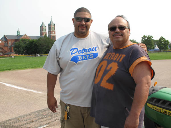 Juan Carlos Sanchez, left, and Ismael Ledesma maintain St. Hedwig Park in southwest Detroit. (Bridge photo by Bill McGraw)