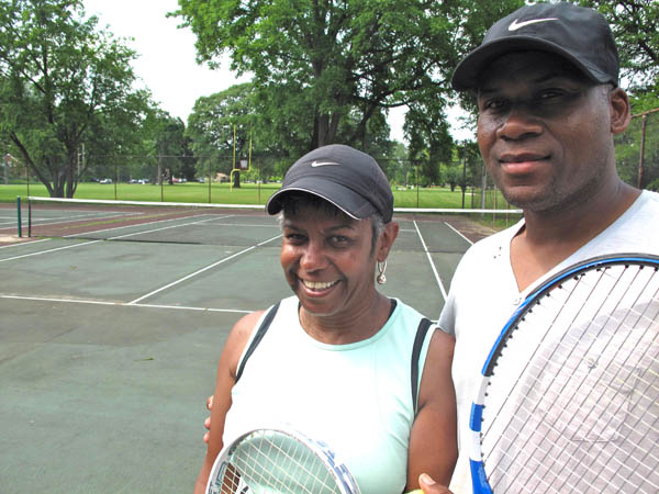 Debbie Kent and Ronald Parker have been playing tennis for 30 years at Stoepel Park No. 1 on Detroit's west side. (Bridge photo by Bill McGraw)