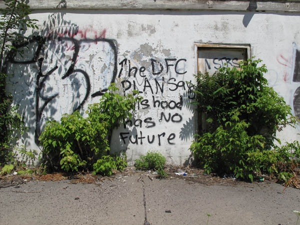 Graffiti on an abandoned building in a depopulated neighborhood at 31st and Buchanan on the west side reflects uncertainty in many areas of the city. It says, "The DFC plan says this hood has no future." (Bridge photo by Bill McGraw)