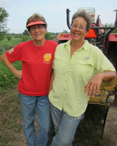 At Crane Dance Farm south of Grand Rapids, Mary Wills, left, and Jill Johnson raise heirloom pork, grass-fed beef and lamb. (Courtesy photo) 