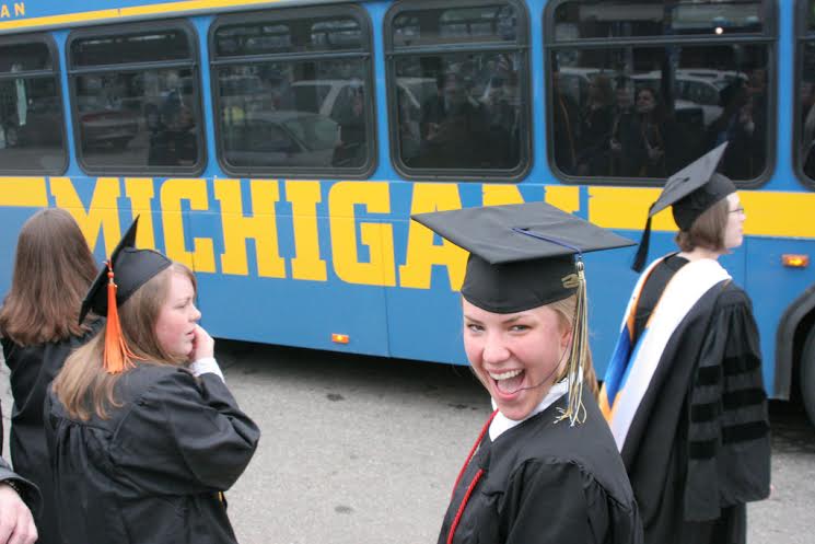 Graduating with a smile? Students with heavy loan debt may find the celebration short-lived. Participants in The Center for Michigan's Community Conversations say higher education is a must to join the middle class, but affordability is a real concern. (Photo by Bill Couch via Flickr; used under Creative Commons license)