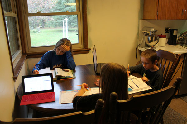 Online schooling allows children in Ironwood in the Upper Peninsula to take classes from a school based in Okemos. From left to right, fifth-grader Gabbi Maki, first-grader Brynn Maki, and third-grader Keaton Maki, are enrolled in Michigan Connections Academy. (courtesy photo)