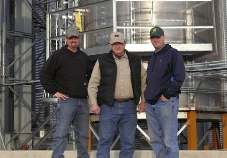 Jeff Oesterle, center, is one of a growing number of Michigan farmers who continue to work the fields after age 65. He has help on his farm from his sons, Don, on the left, and Russ, right. (Courtesy photo)