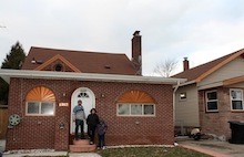 Fahman Amri with his sons in front of their Detroit home. (Courtesy photo) 