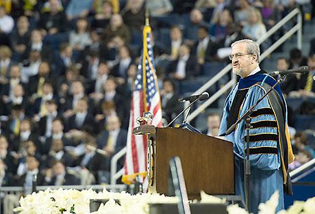 resident Mark Schlissel addresses graduates and guests at the December 2015 winter commencement ceremony. (Photo by Eric Bronson, Michigan Photography)