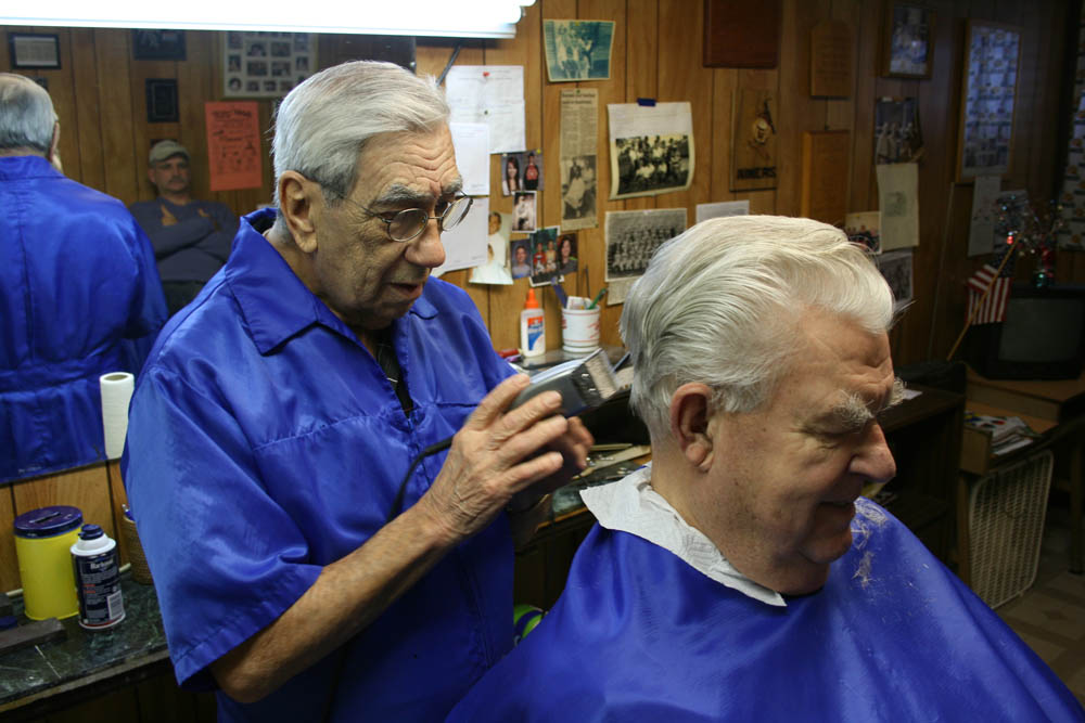 Negaunee barber Paul Remillard says “everybody would move out” if the mines close. (Photo by Ted Roelofs)