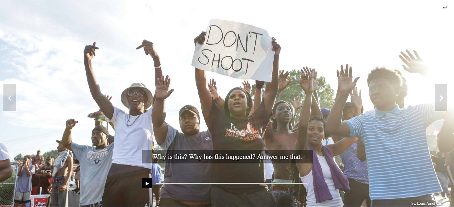 Protestors in Ferguson chanted, "Hands up! Don't shoot!" (photo by Wiley Price, Saint Louis American)