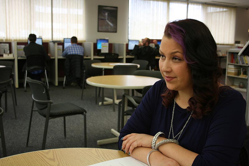 Part-time worker Nicole Jensen, at a Holland jobs fair: “It's really paycheck to paycheck.” (Photo by Ted Roelofs)