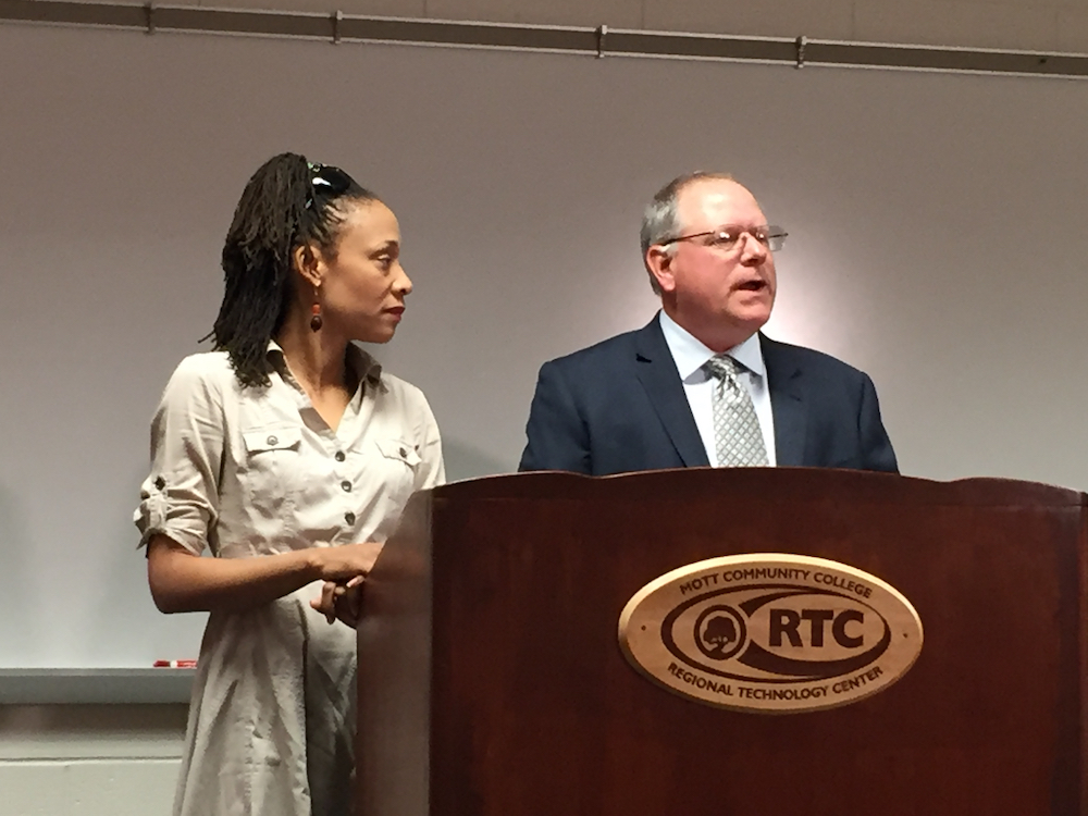 Bridge staff writer Chastity Pratt Dawsey and Center for Michigan President John Bebow speak at the launch of “Poison on Tap,” a compilation of Bridge journalism about the Flint water crisis. (Bridge photo by Nancy Derringer) 