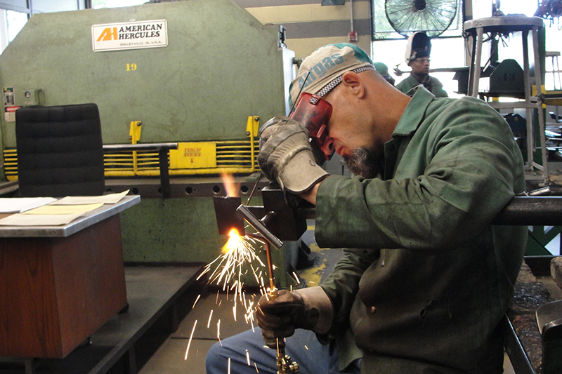 Gary McKissack, an inmate at the Richard A. Handlon Correctional Facility in Ionia, participates in a welding training program as part of the Michigan Department of Corrections' new Vocational Village program. (Bridge/Crain’s photo by Lindsay VanHulle) 