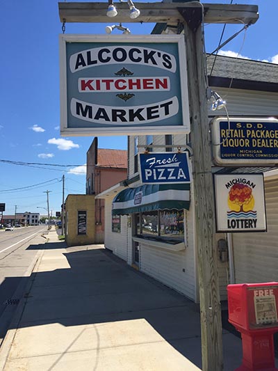 Alcock’s Market in Cheboygan closed earlier this year after a Speedway expanded its offerings, including pizza by the slice. (Photo by Jacob Wheeler) 
