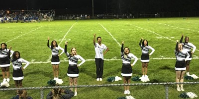 East Detroit High cheerleaders pepped up the crowd at a recent football game versus Lakeview High, a school in St. Clair Shores. East Detroit Schools have become majority African American as more black students enrolled as many of their white classmates now attend school in St. Clair shores. (Bridge photo by Chastity Pratt Dawsey)