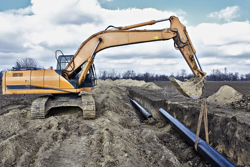 18119430 - construction site, excavator wearing metal pipe