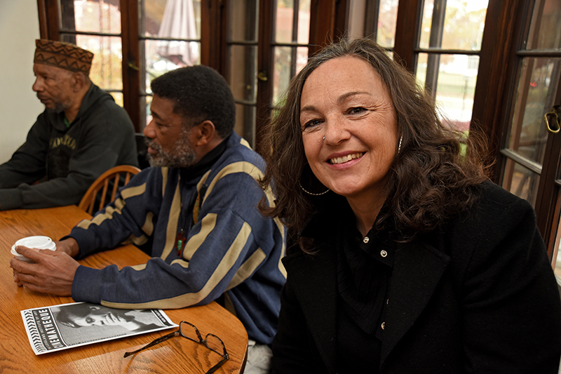 Auburn Sheaffer Sandstrom, a doctoral candidate at Cleveland State University, meets with the African Wisdom Circle, an informal weekly coffee-house group in University Heights, Ohio, that includes James E. Page, left, and John Omar. The group discusses issues of race, gender and the meaning of being human. (Photo by Peggy Turbett)