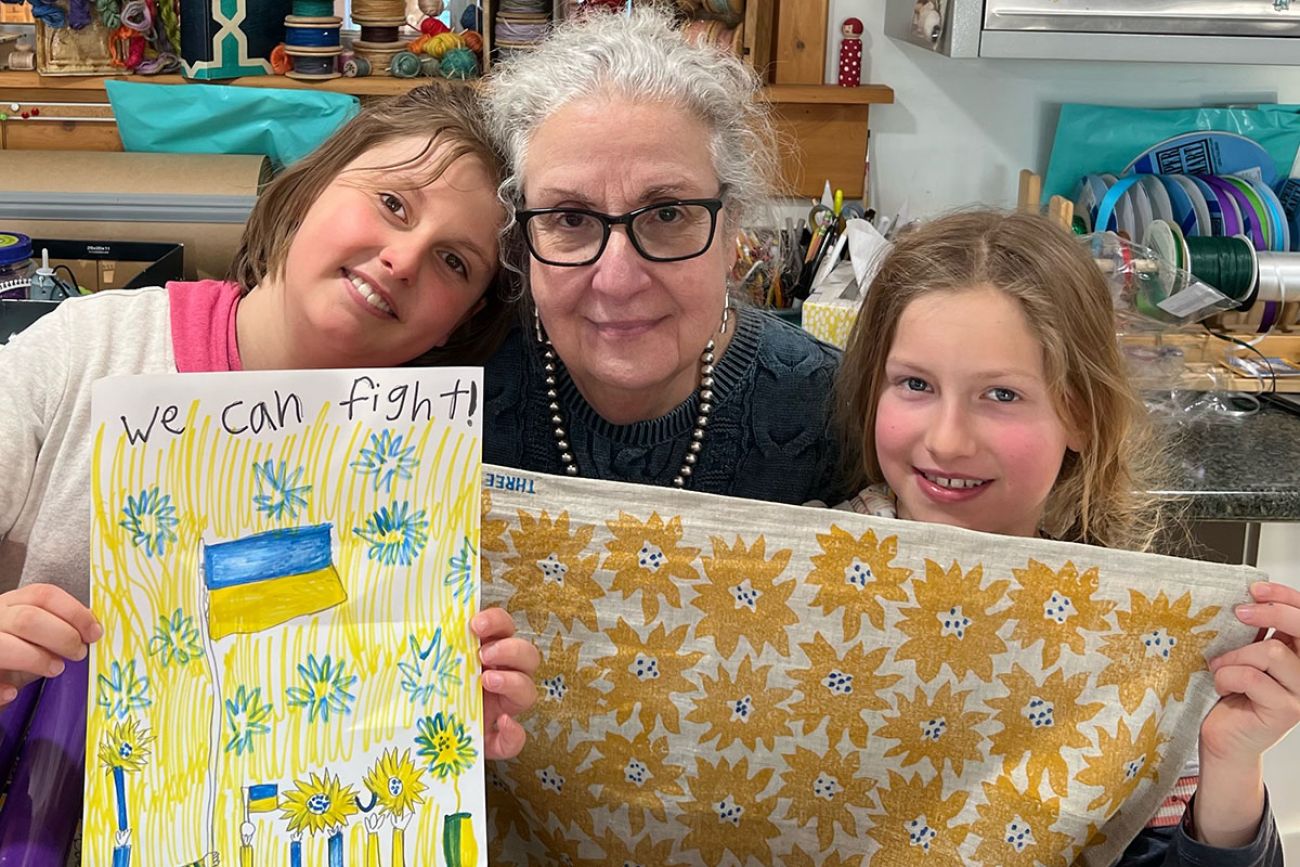 Joann Condino with kids holding towel