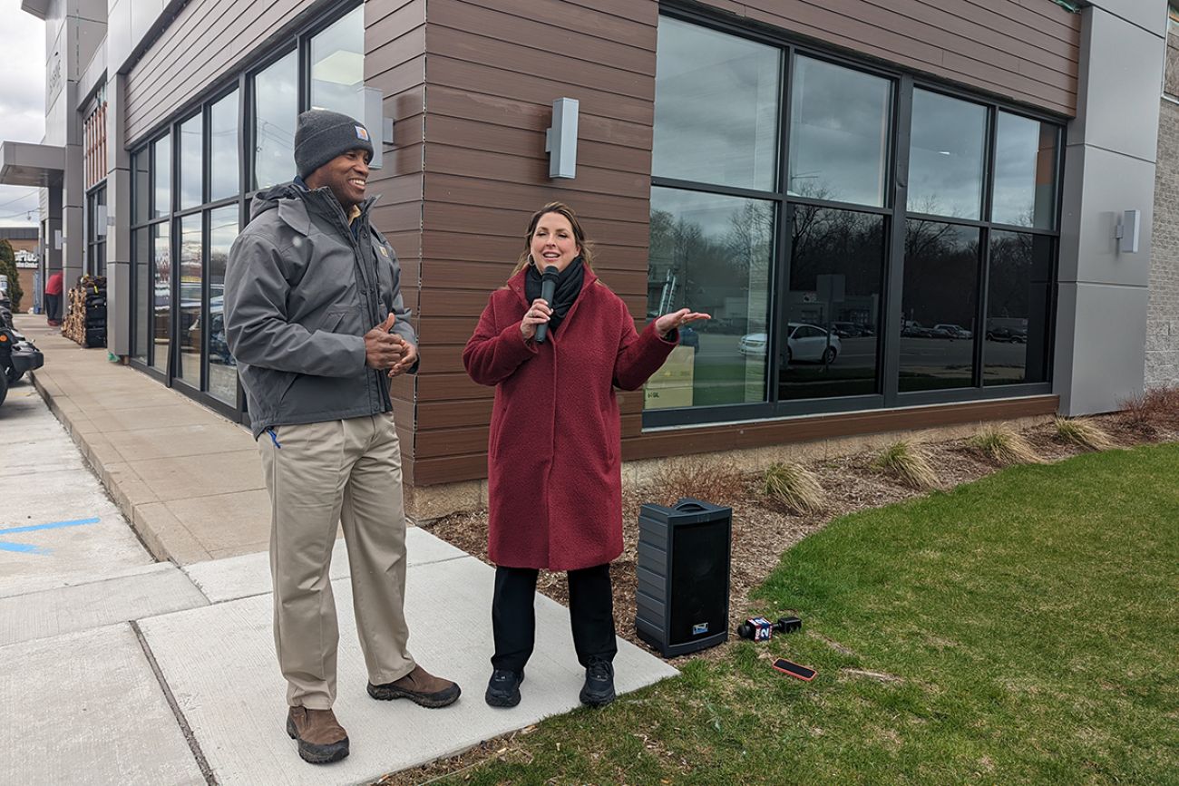 John James and Ronna Romney McDaniel outside