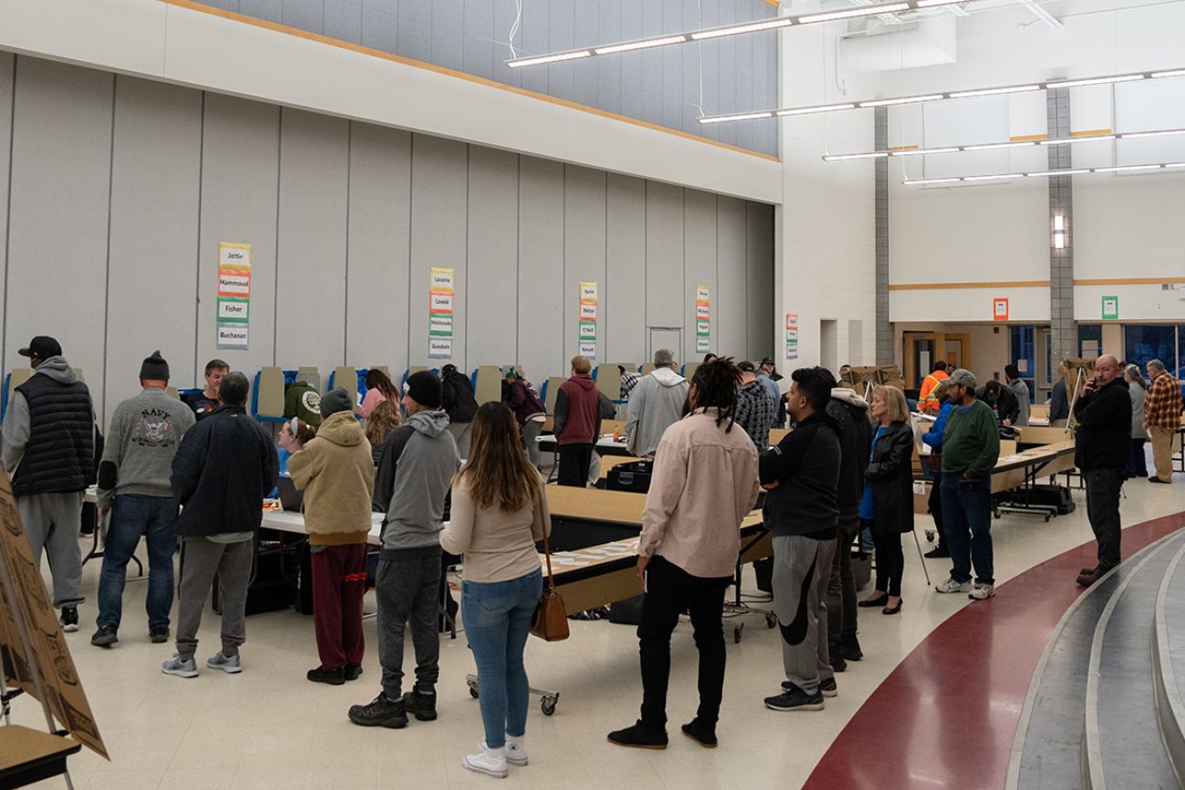 people in line waiting to vote