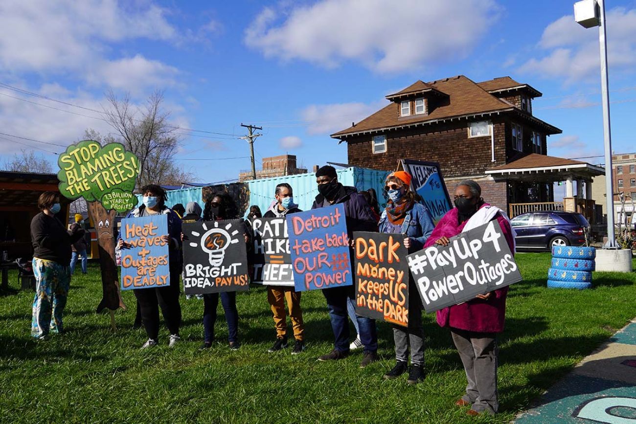 people outside with signs