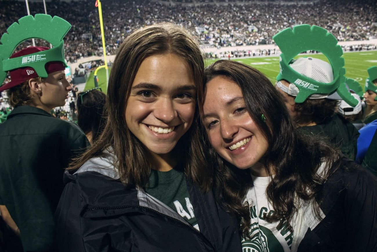 Kirin Krafthefer with a friend at a MSU game