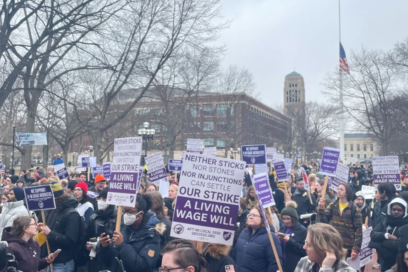 People protest in U-M Diag with signs