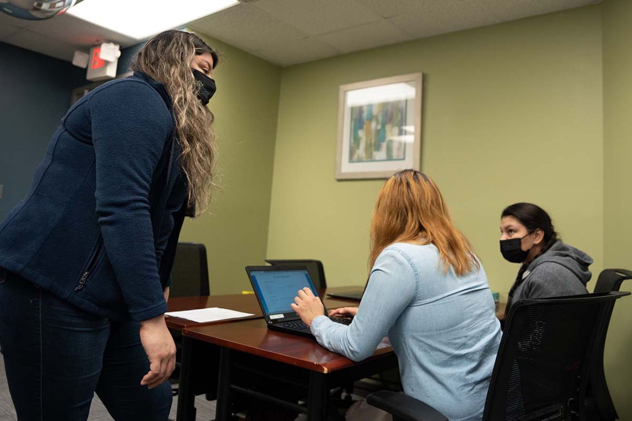 people around a desk 