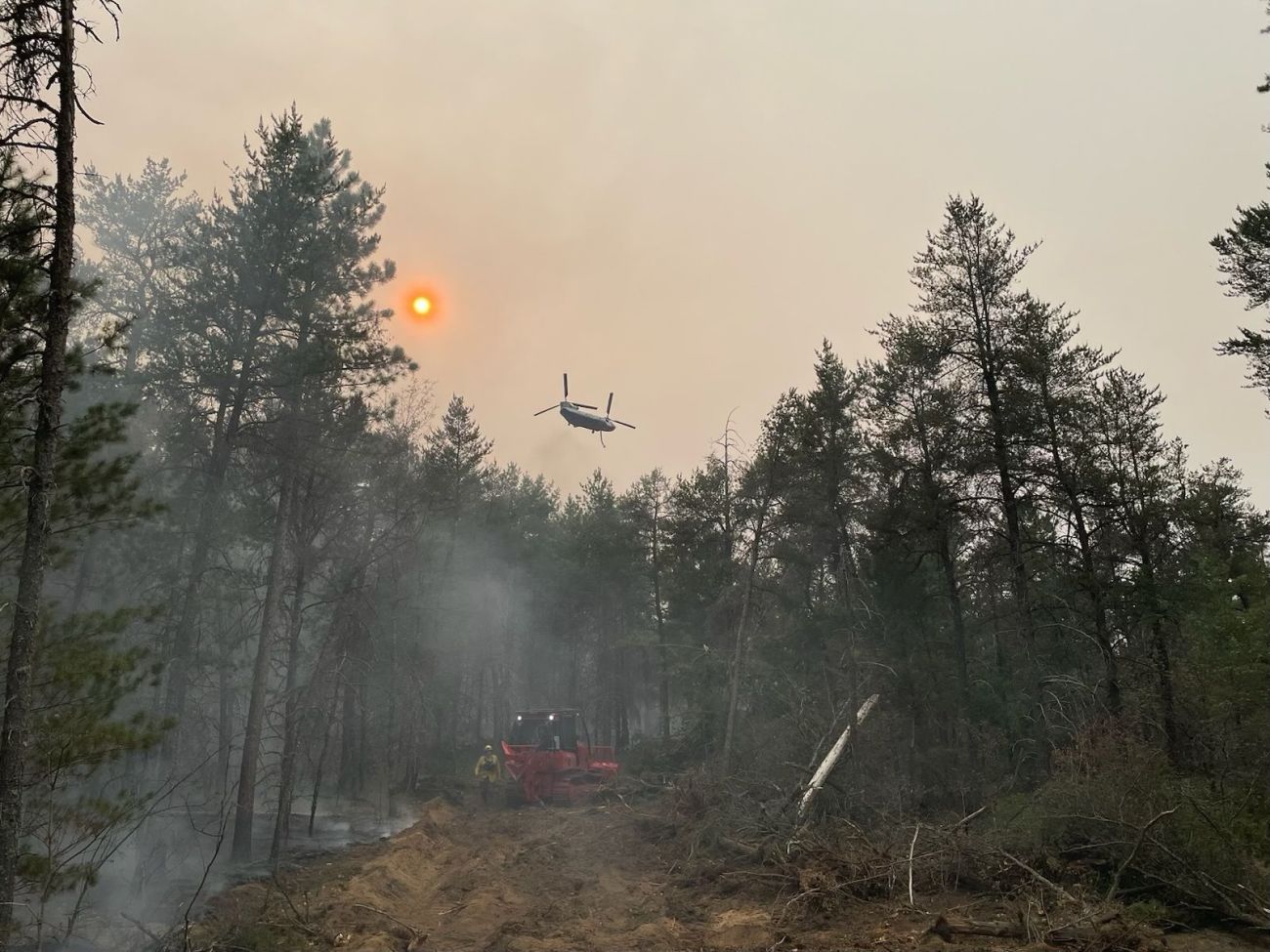 Aircraft flying over forrest fire in Michigan