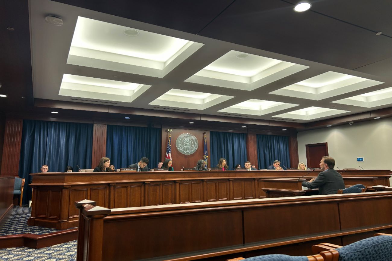 People sitting in committee room