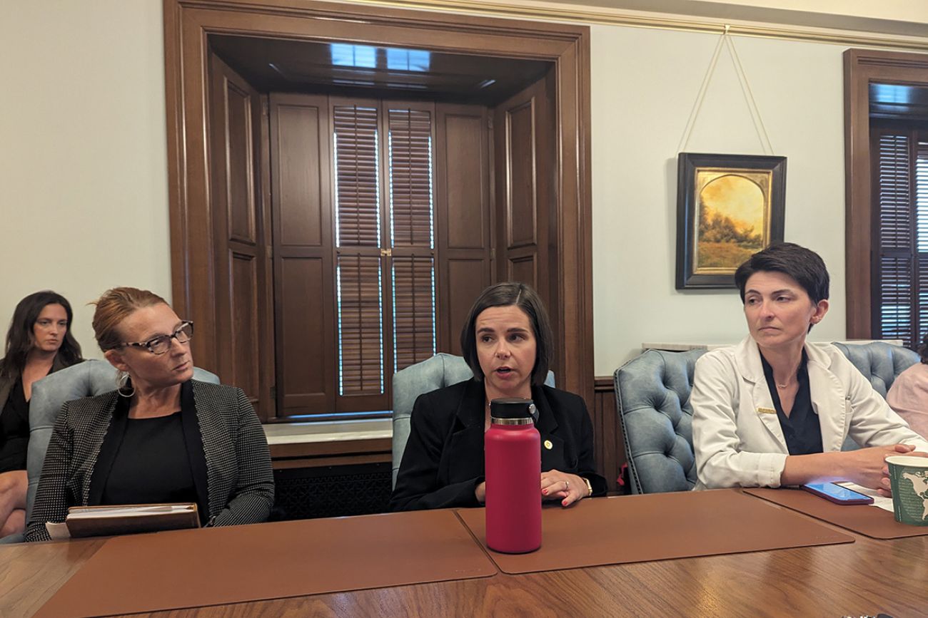 Michigan Rep. Laurie Pohutsky, D-Livonia, sits at a table