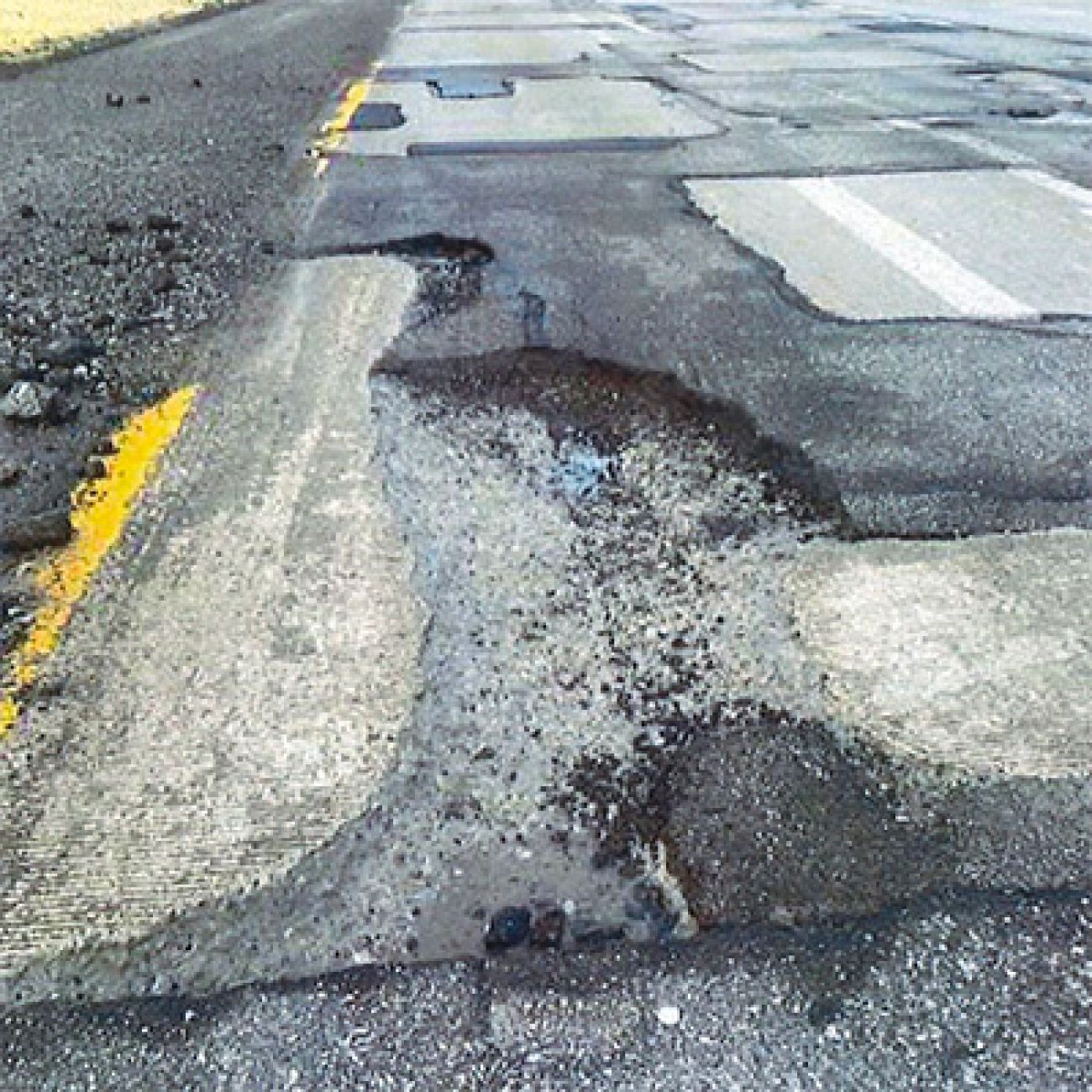 https://www.bridgemi.com/sites/default/files/styles/full_width_image/public/2023-09/pothole%202%20damage%20claim.jpg?itok=xwiOShnb