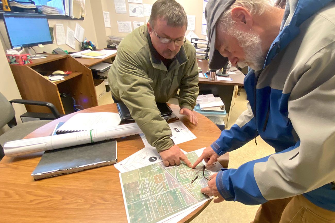 two people reading a map