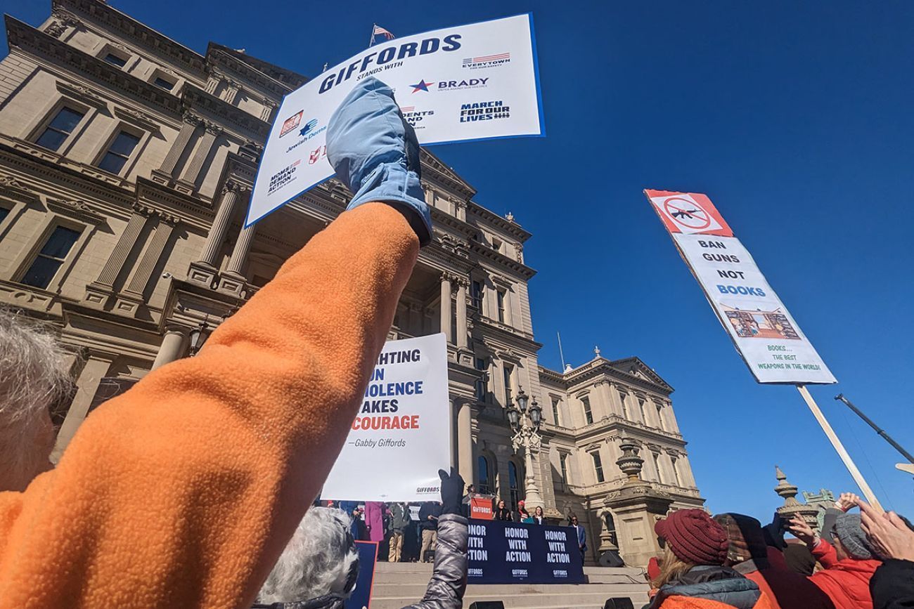 gun control advocates holding signs