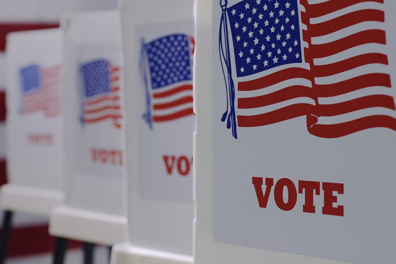 Straight on row of voting booths at polling station during an election. 