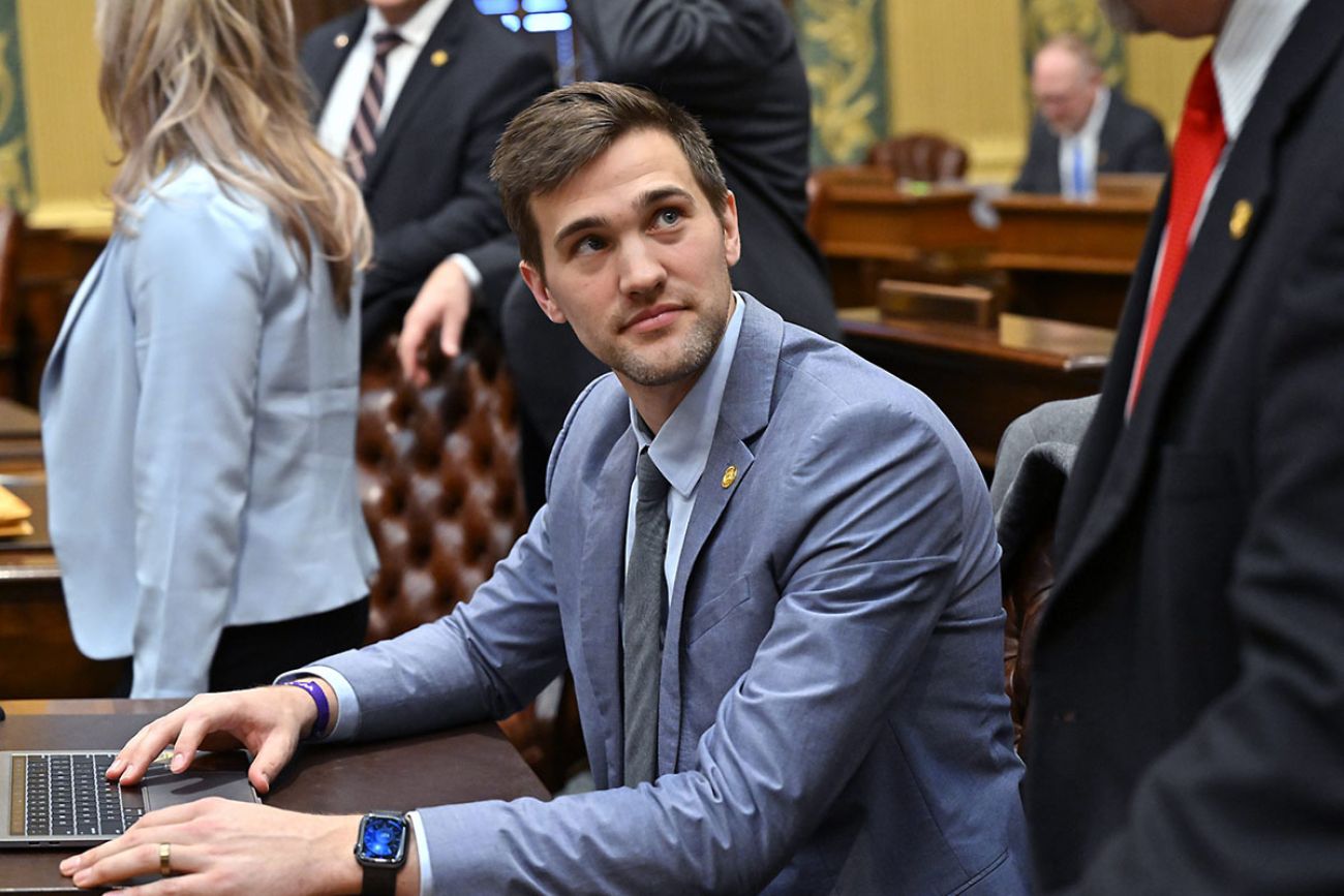  Rep. Josh Schriver sitting at a table