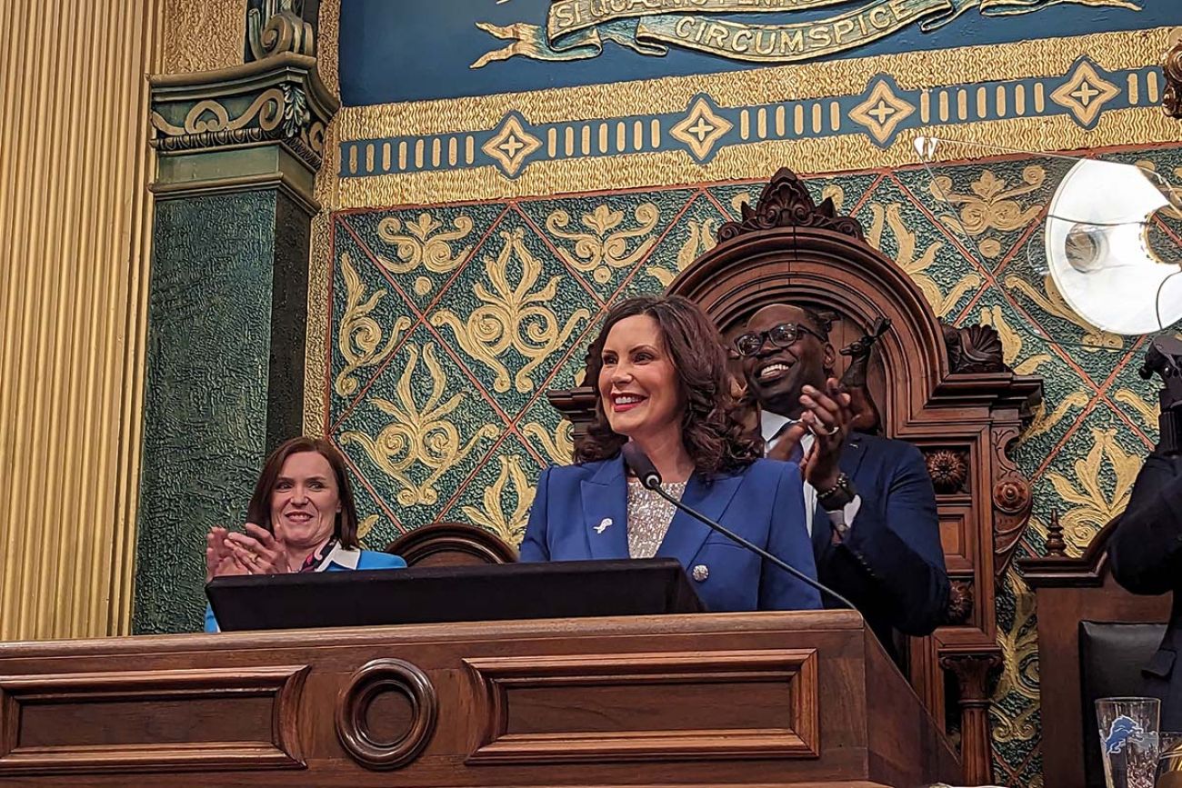 Gov. Gretchen Whitmer speaking into a microphone