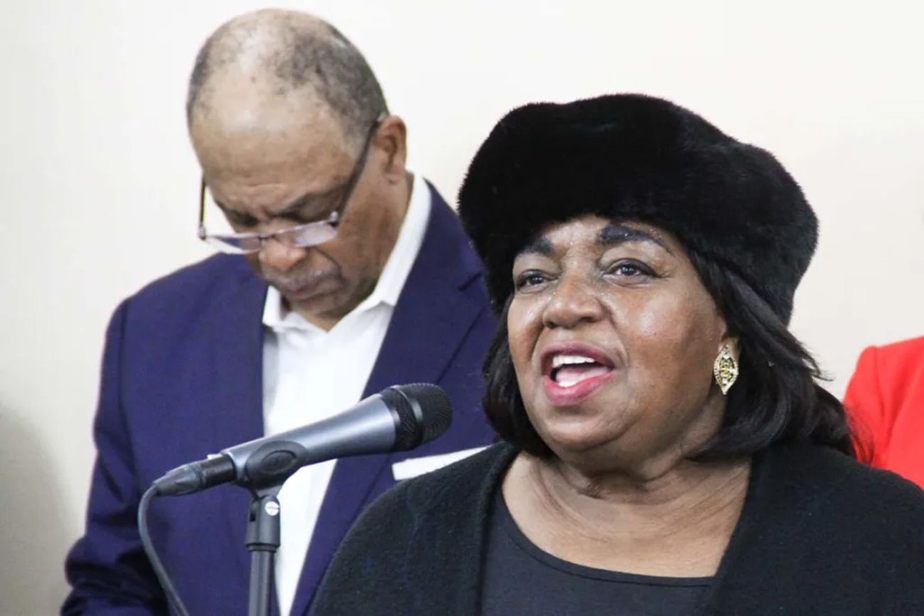 Rev. JoAnn Watson speaking into microphone